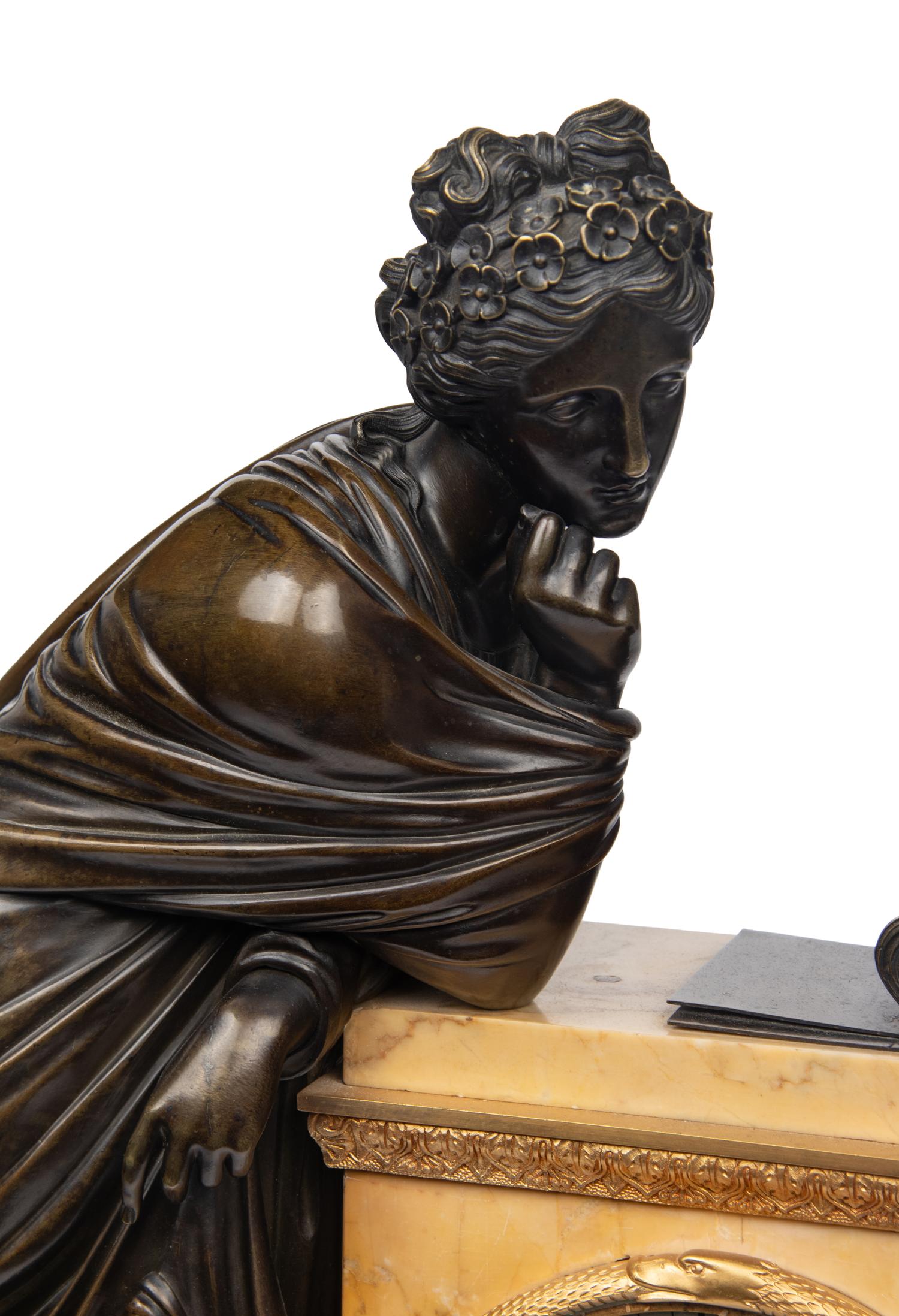 A Large Empire Gilt and Patinated Bronze and Marble Figural Clock