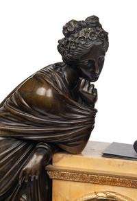 A Large Empire Gilt and Patinated Bronze and Marble Figural Clock