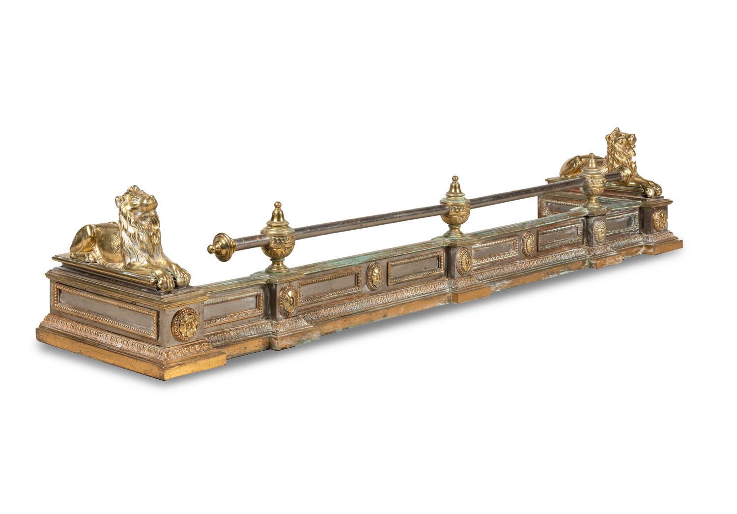 An Empire Style Brass and Steel Fire Fender with Recumbent Lions