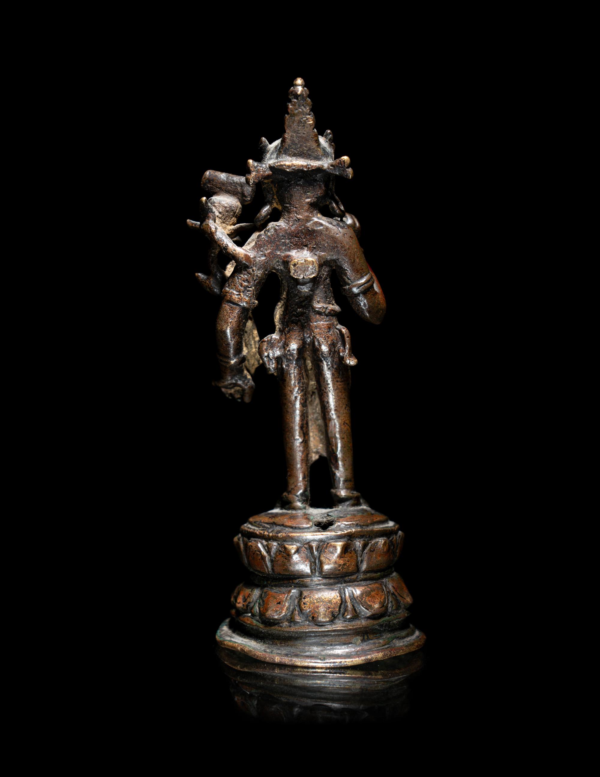 A Nepalese Parcel-Gilt Bronze Figure of Standing Avalokiteshvara