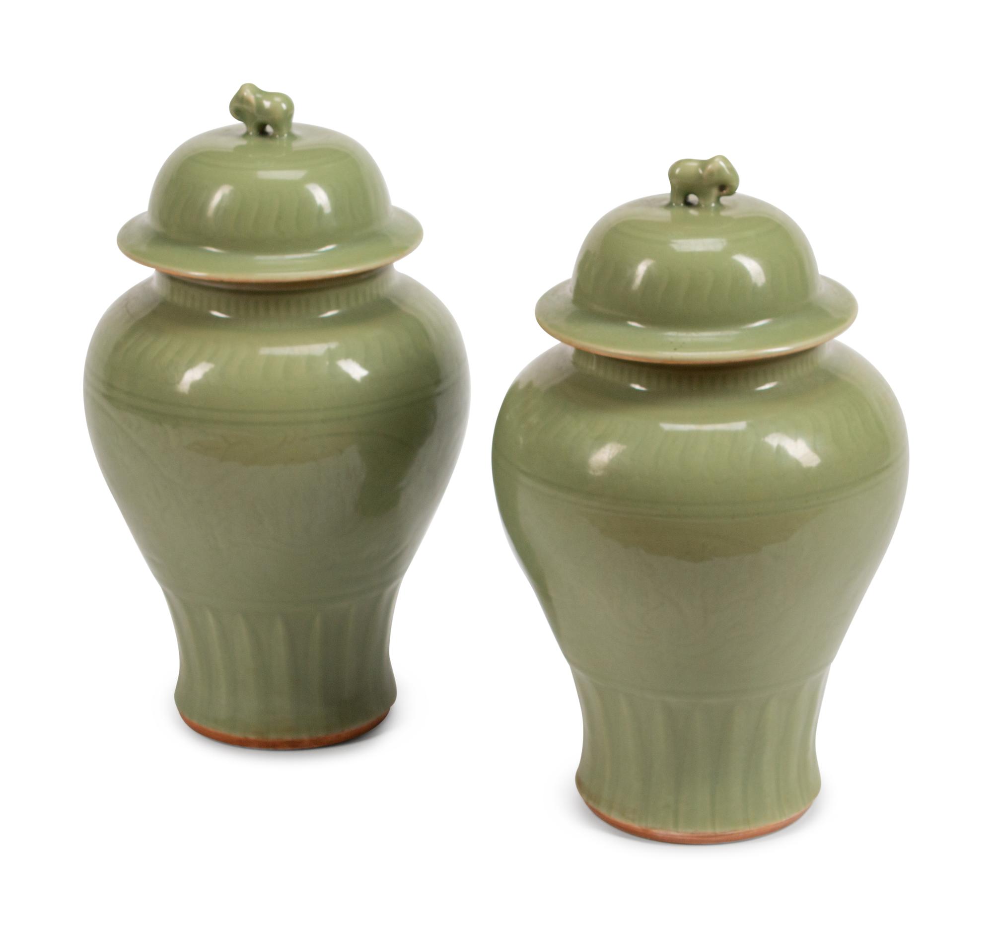 A Pair of Chinese Celadon-Glazed Porcelain Meiping Vases and Covers