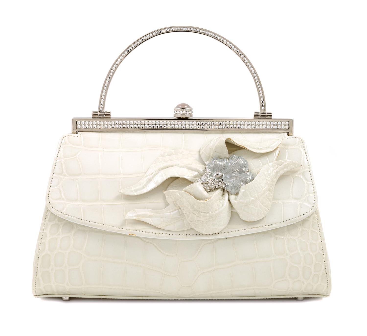 A Judith Leiber Cream Crocodile Handbag, 6.5" x 5" x 4".