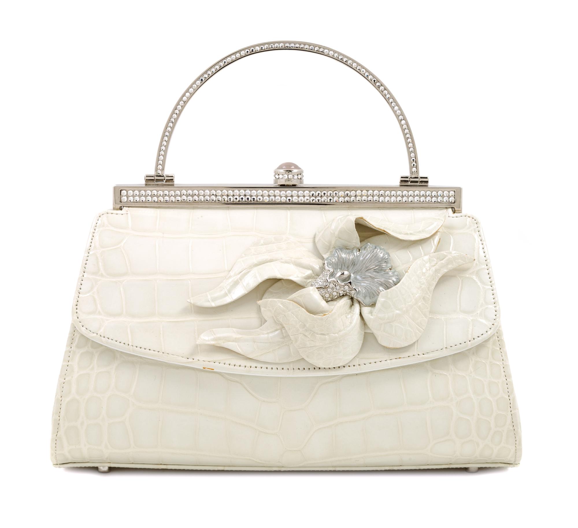 A Judith Leiber Cream Crocodile Handbag, 6.5" x 5" x 4".