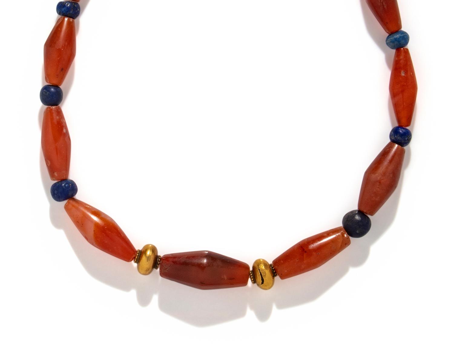 A Western Asiatic Carnelian, Lapis Lazuli, and Gold Bead Necklace