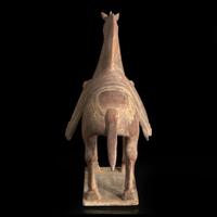 A Chinese painted and parcel-gilt pottery figure of a caparisoned horse 彩绘漆金陶马 Northern Wei dynasty ??