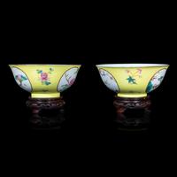 A Pair of Chinese Sgraffito Ground Yellow Glazed Famille Rose Porcelain 'Floral' Bowls, Late 19th/early 20th Century 晚清/民國 黃地軋道開光花卉紋碗一對