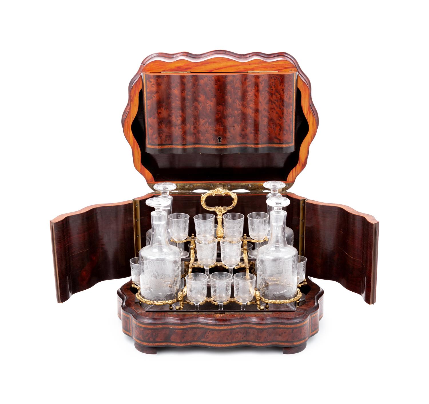 A Napoleon III Parcel Ebonized Amboyna Cave à Liqueur