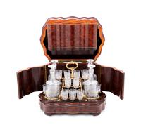 A Napoleon III Parcel Ebonized Amboyna Cave à Liqueur