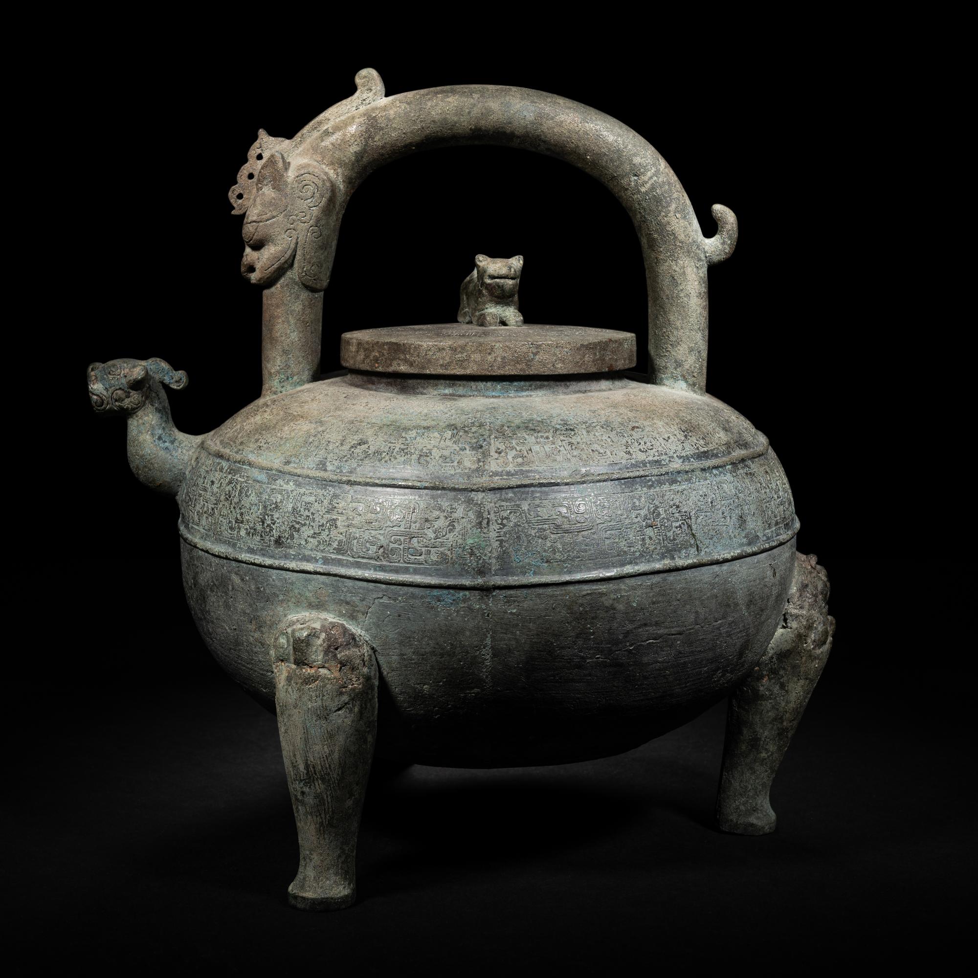 An Archaic Bronze Tripod Wine Vessel, He