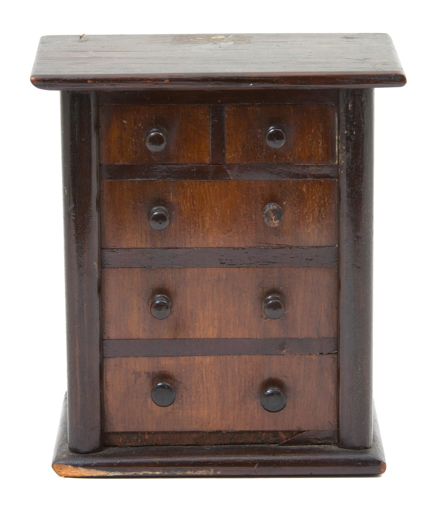 A Miniature Chest of Five-Drawers Height of chest 6 3/4 inches. — 19TH CENTURY