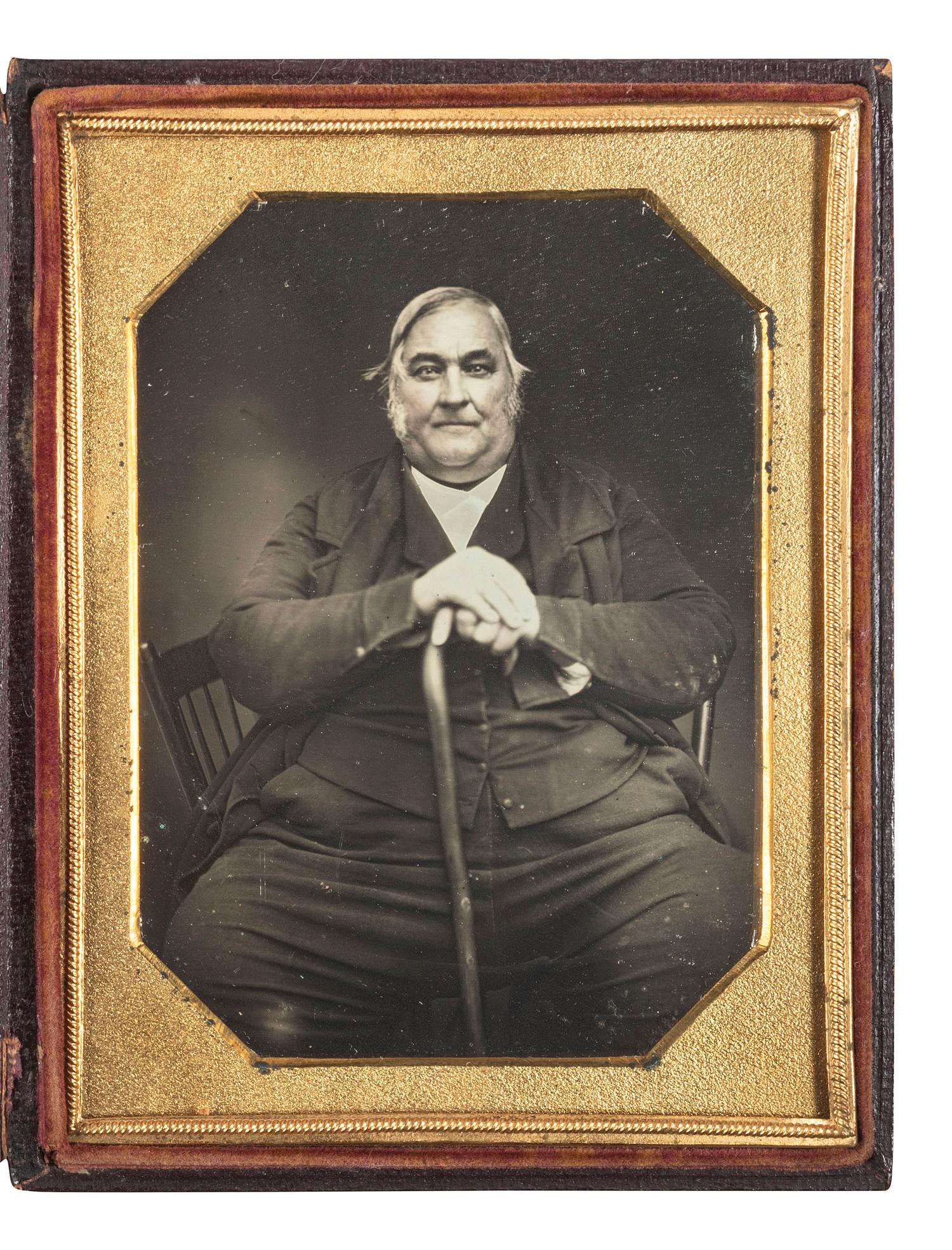 [EARLY PHOTOGRAPHY]. Quarter plate daguerreotype featuring a portly gentleman with a cane, tentatively identified.