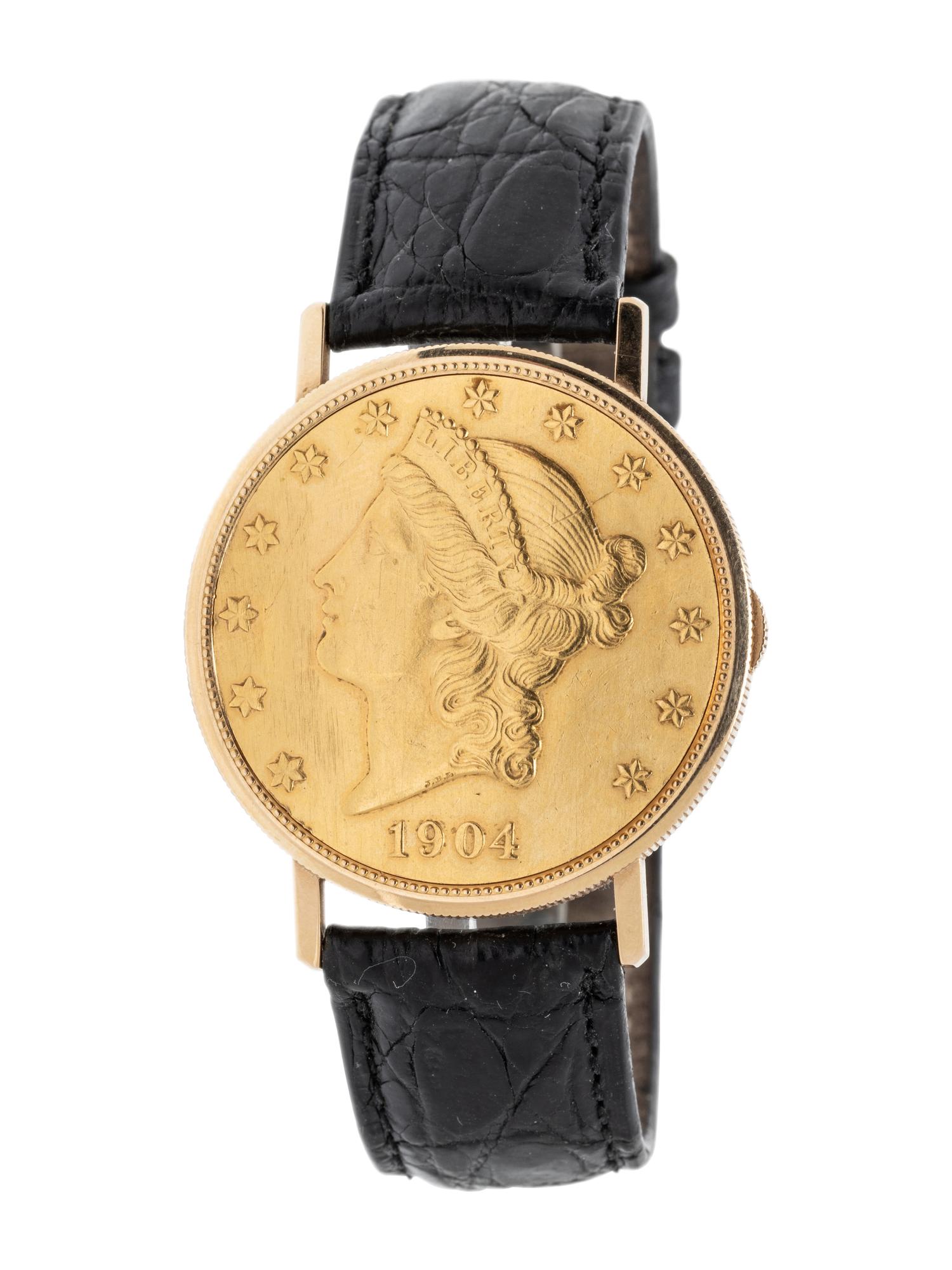 BAUME & MERCIER, YELLOW GOLD HIDDEN DIAL COIN WATCH