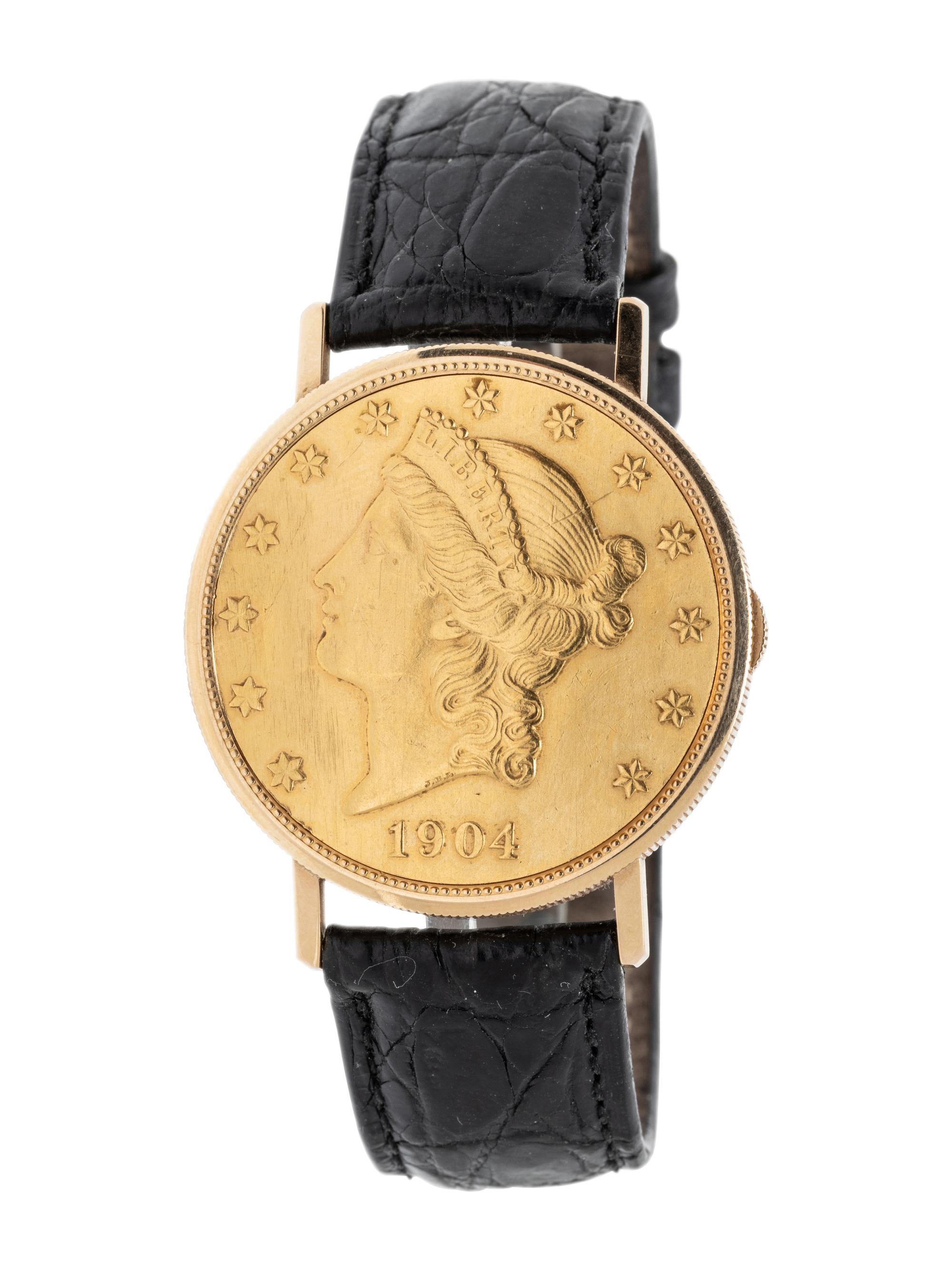 BAUME & MERCIER, YELLOW GOLD HIDDEN DIAL COIN WATCH