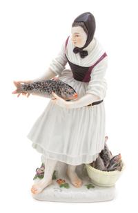 A Meissen Porcelain Figure of a Girl Fishmonger — 18TH CENTURY