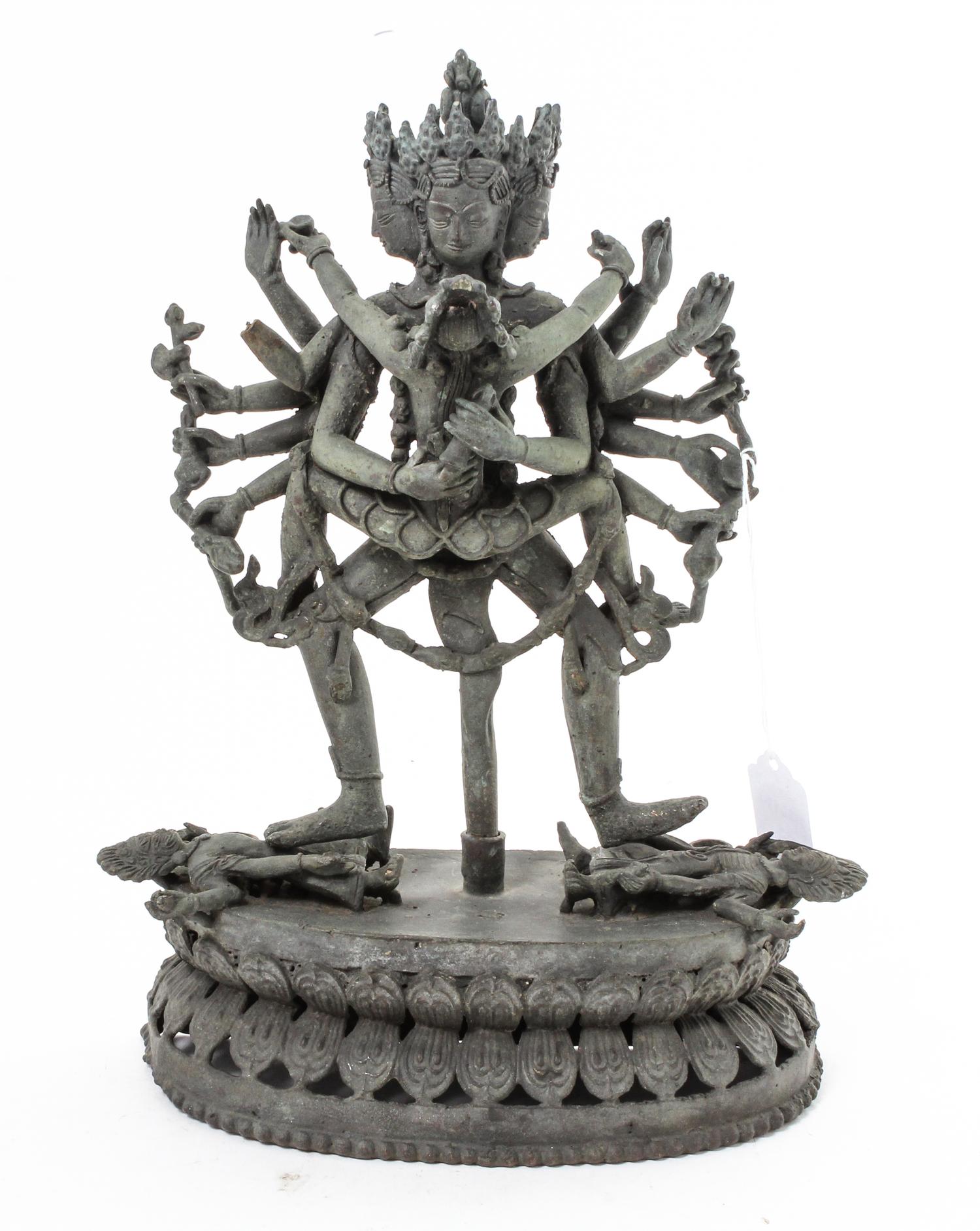 A Nepalese Cast Metal Figural Group Height 12 inches. — 20TH CENTURY