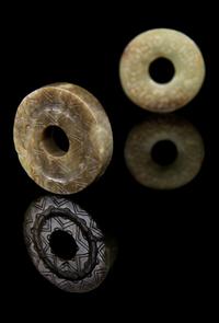 Two Jade Bis Diameter of first 2 3/8 inches.