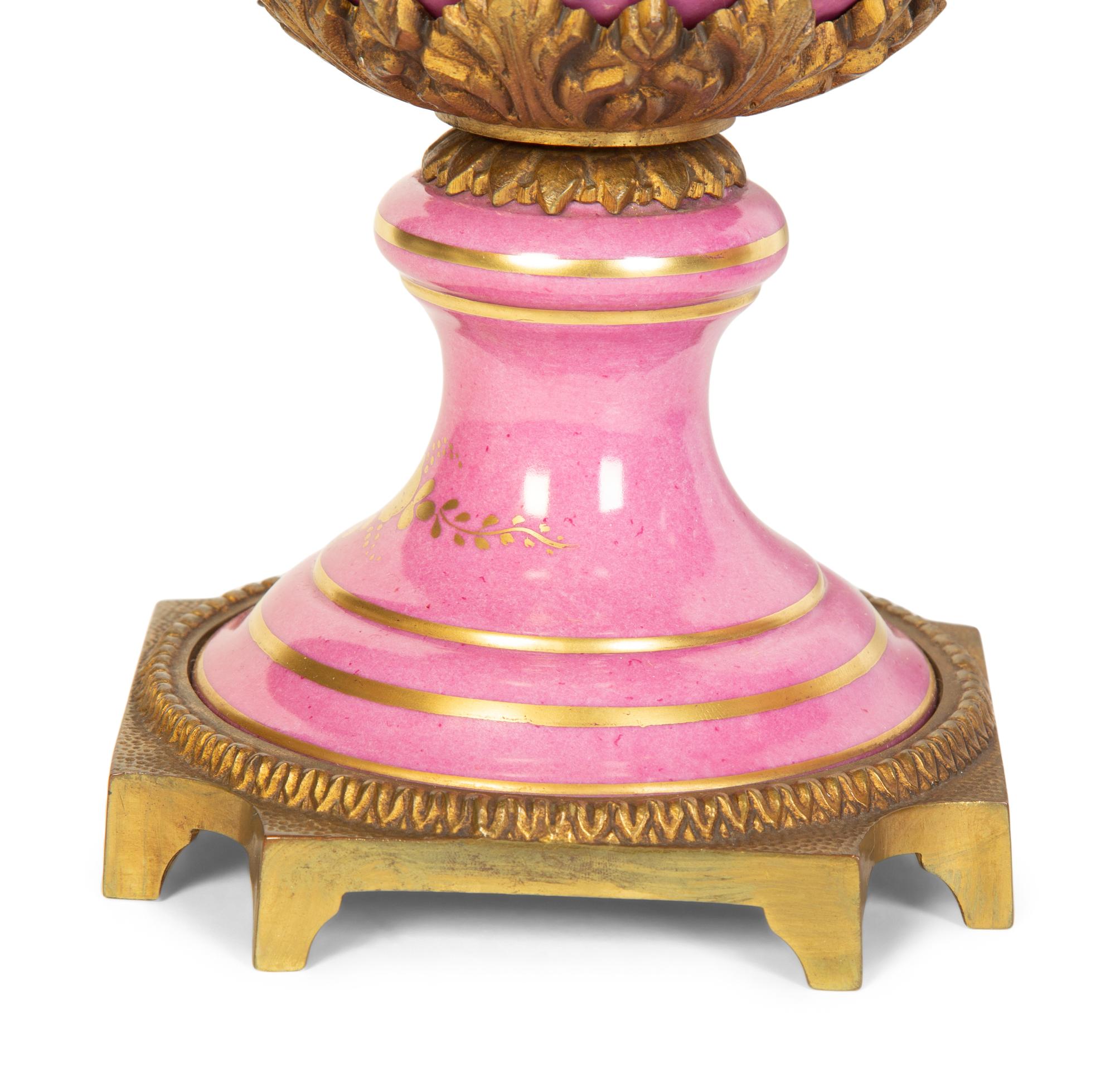 A Pair of French Porcelain Lidded Urns
