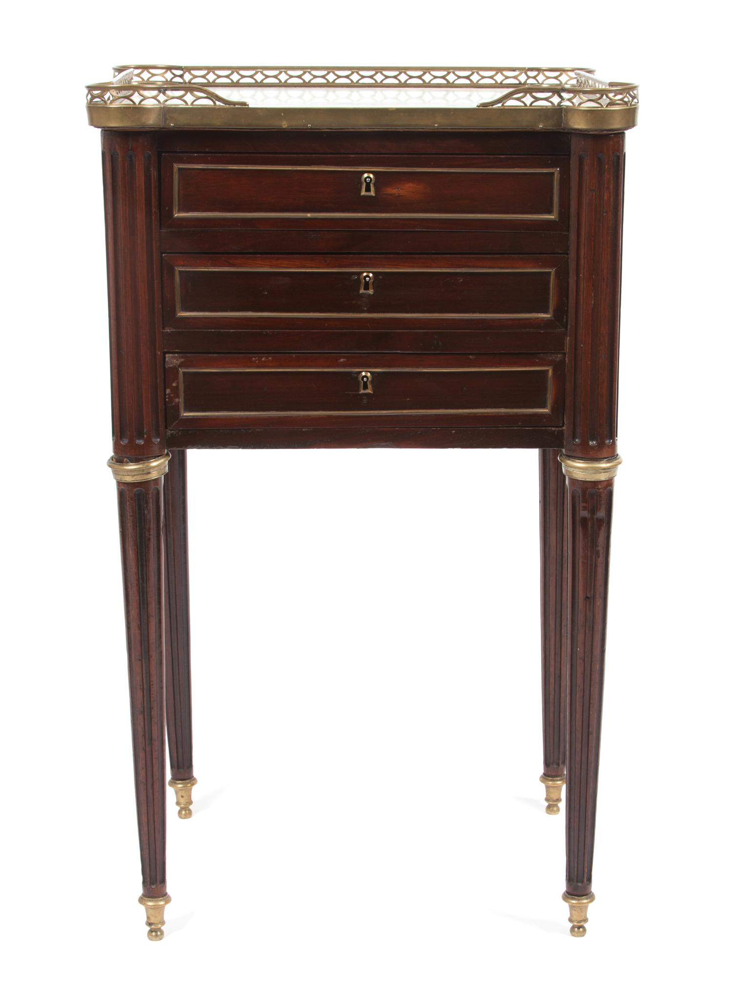 A French Brass Mounted Mahogany Table en Chiffonniere Height 31 x width 18 1/2 x depth 14 1/4 inches.