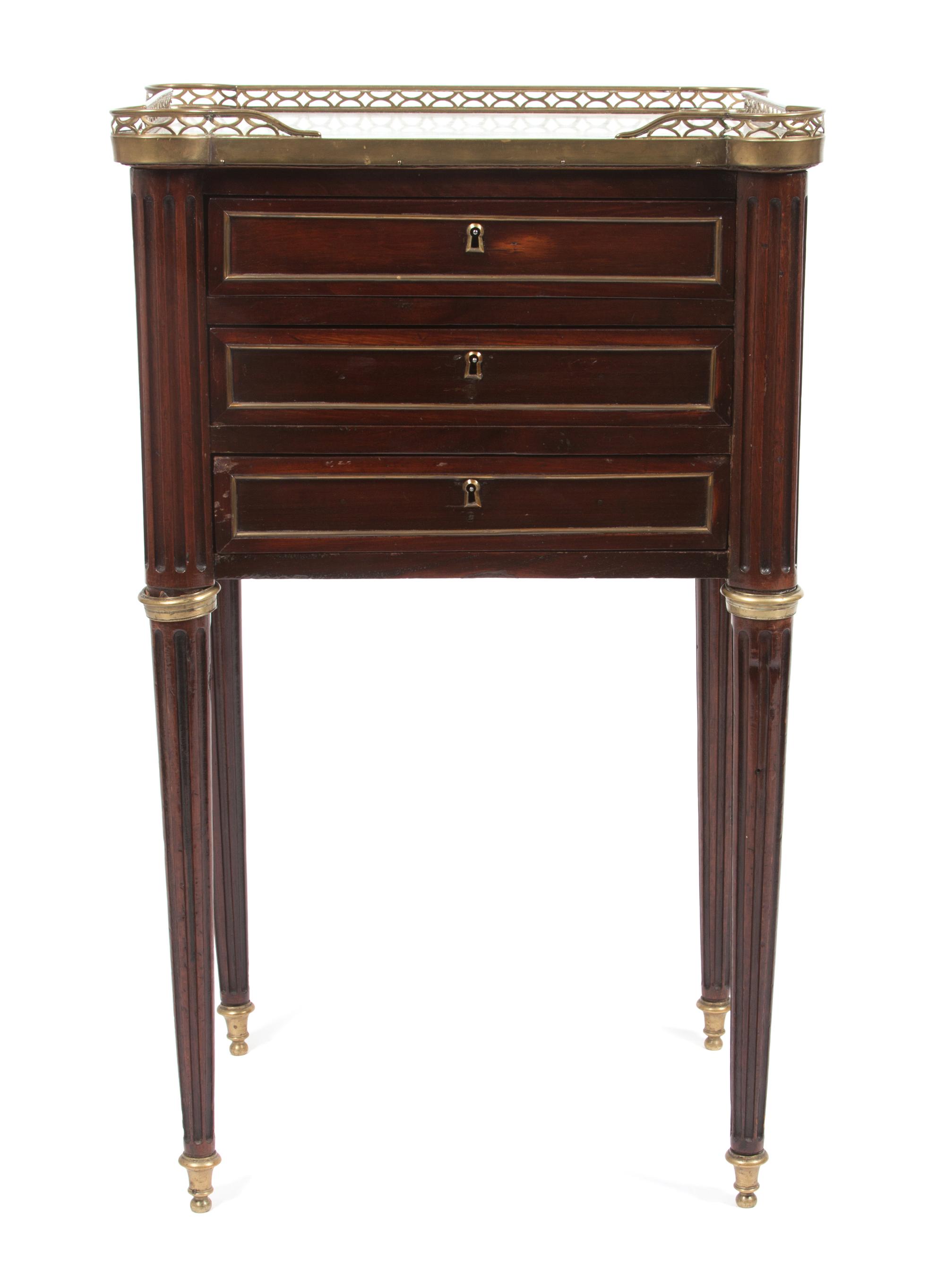 A French Brass Mounted Mahogany Table en Chiffonniere Height 31 x width 18 1/2 x depth 14 1/4 inches.