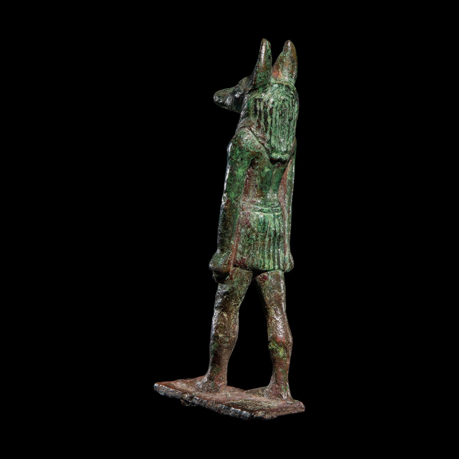 An Egyptian Bronze Striding Anubis