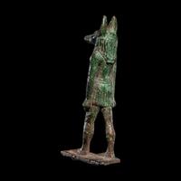 An Egyptian Bronze Striding Anubis