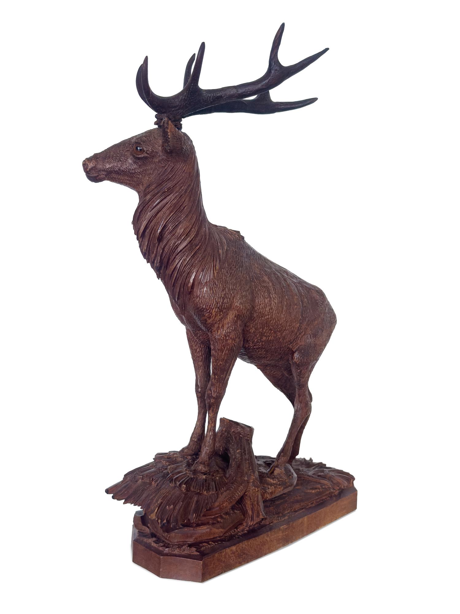 A Swiss Black Forest Carved Stag