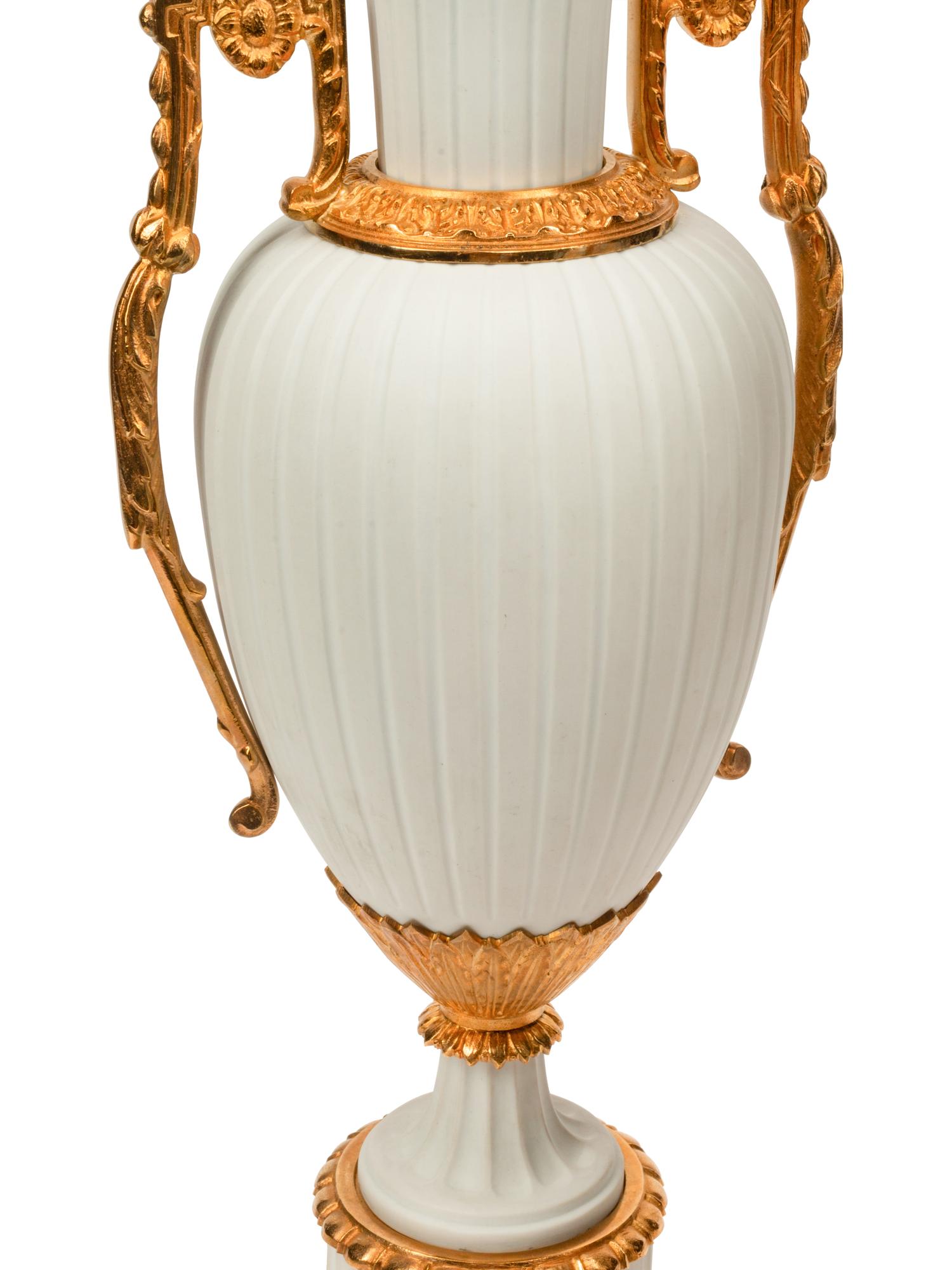 A Pair of Gilt Metal Mounted Bisque Porcelain Lamps