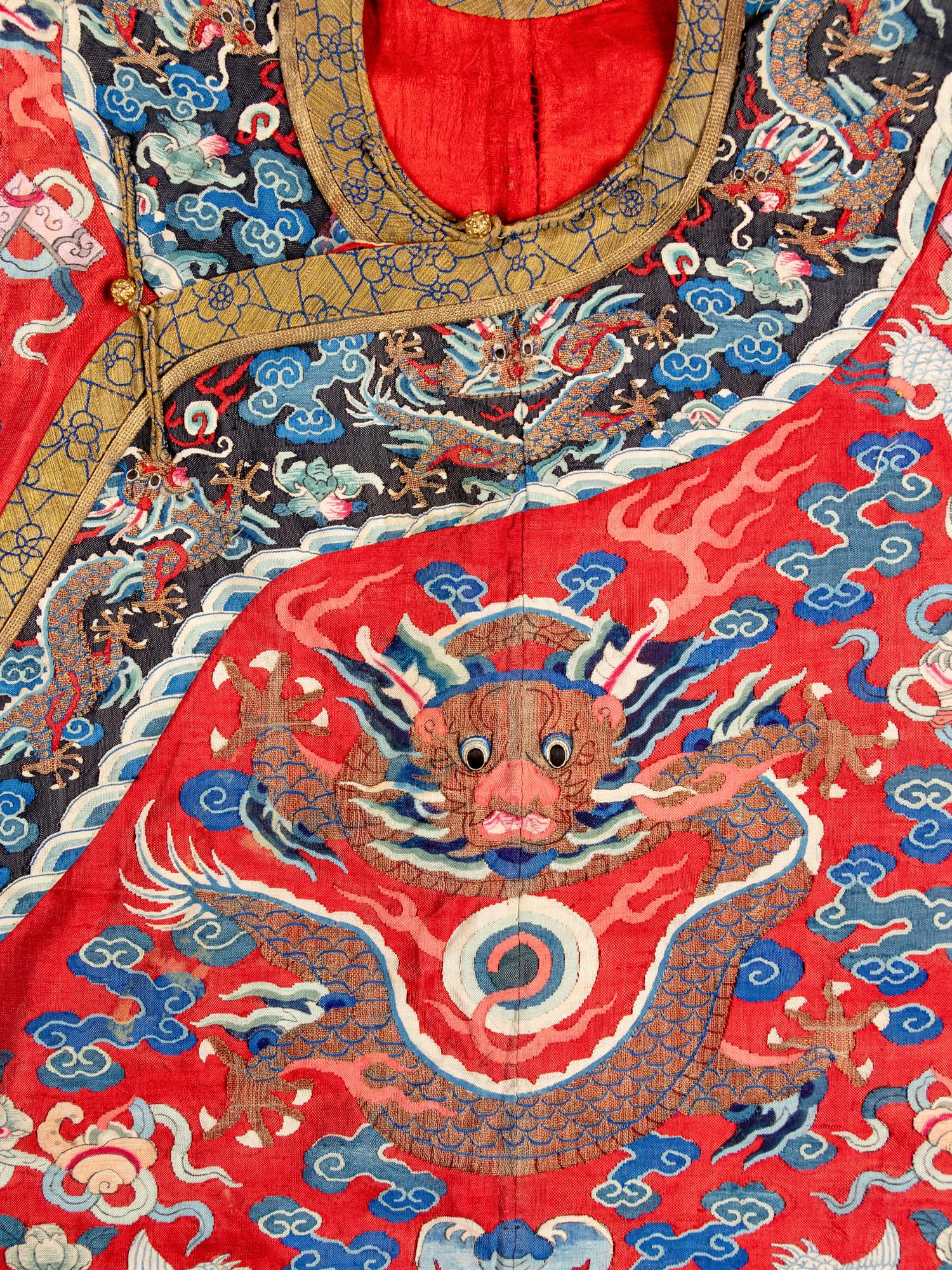A Chinese Red Ground Kesi Silk Dragon Robe, Jifu, 19th Century 清晚期 紅地緙絲龍紋吉服