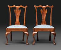 A Pair of Queen Anne Carved Walnut Trifid Foot Side Chairs