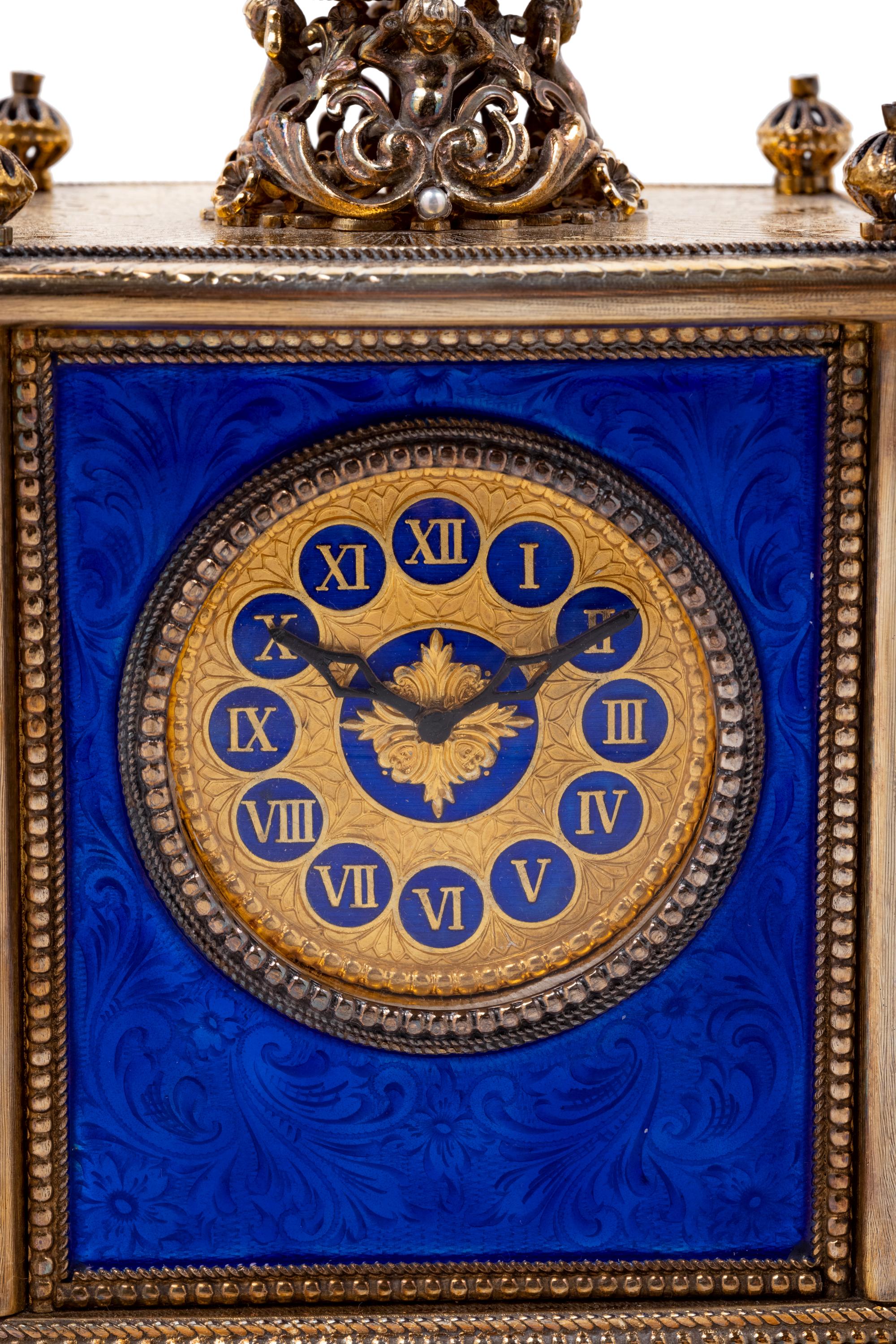 A Continental Blue Hardstone and Cultured Pearl Inset Gilt Metal and Enameled Table Clock
