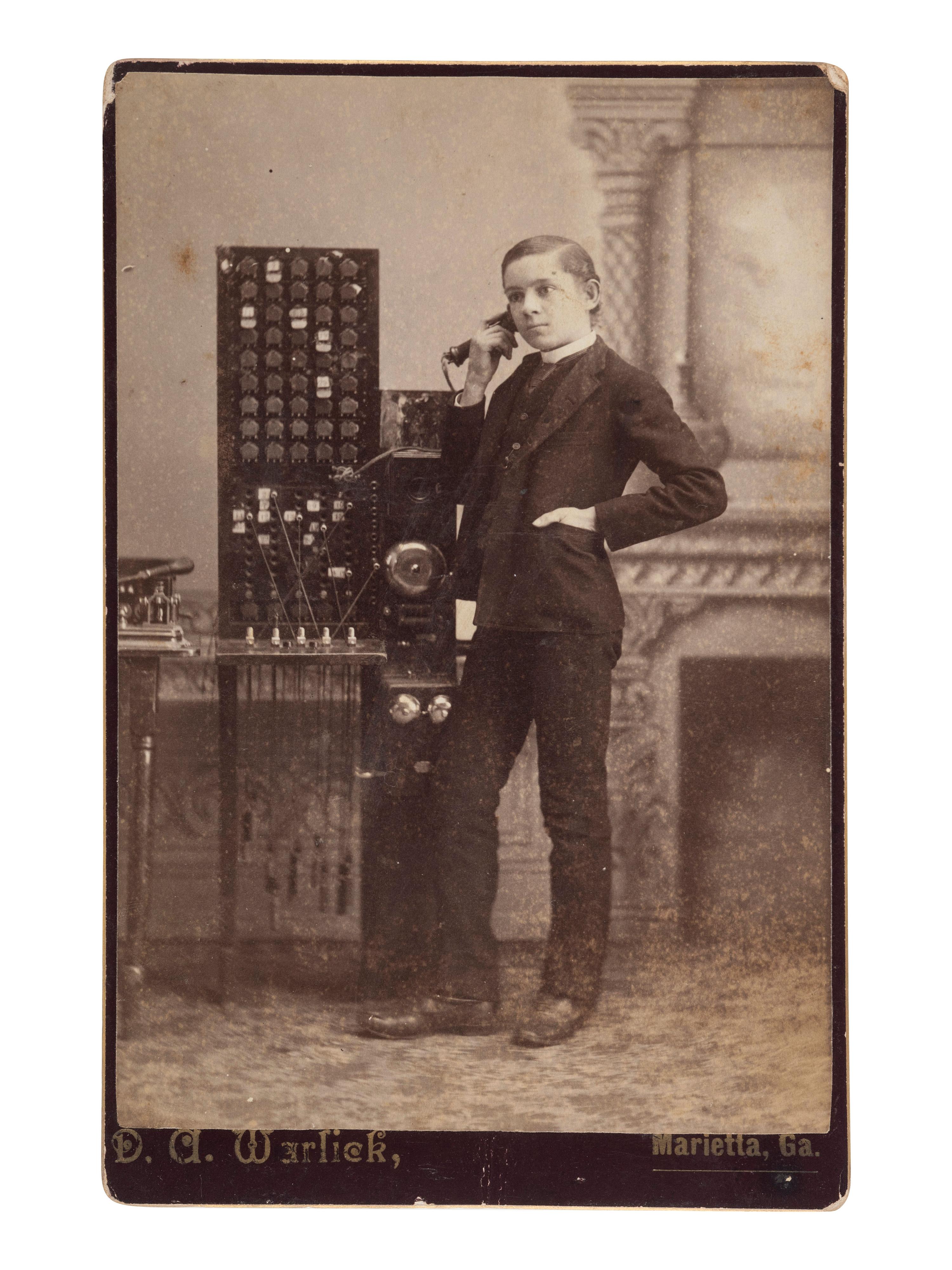 [EARLY PHOTOGRAPHY]. A group of 2 occupational photographs, incl. cabinet card of telephone switchboard operator and possible group of railroad police.