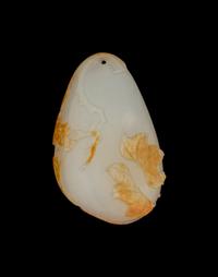 A Chinese Russet and White Jade 'Bird' Pendant