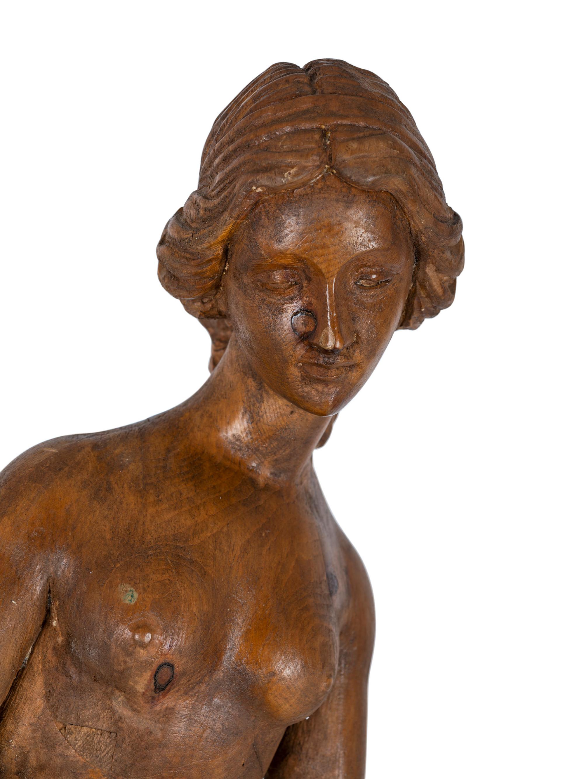 A Classically Inspired Carved Wooden Sculpture of a Standing Nude Female