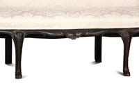 An Italian Carved and Black Painted Walnut High-Back Sofa