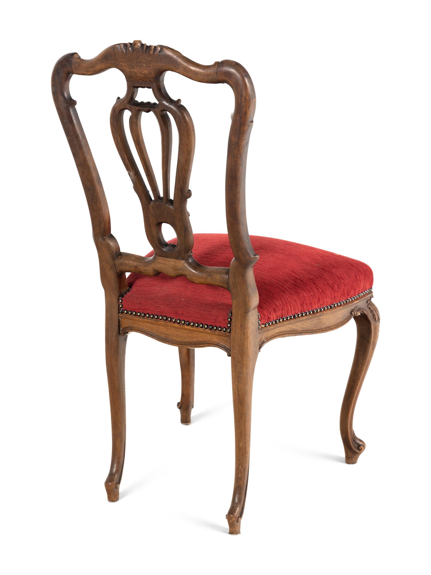 A Set of Five Louis XV Style Carved Walnut Dining Chairs