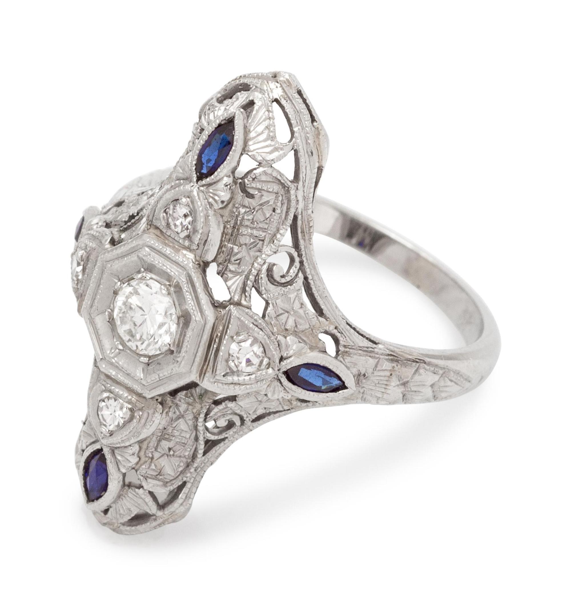 An 18 Karat White Gold, Diamond and Sapphire Ring,
