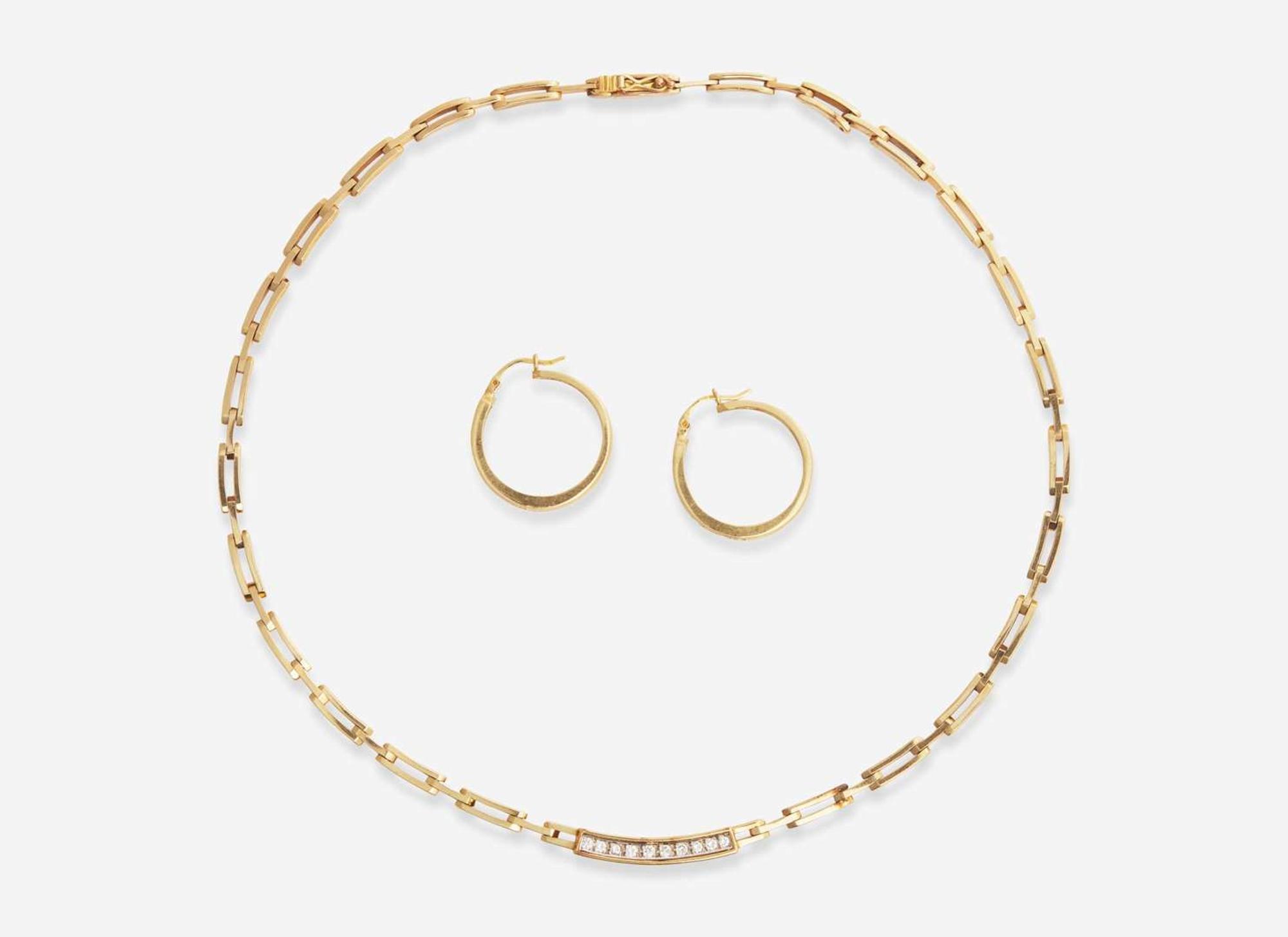 A 14K Yellow Gold and Diamond Necklace and Matching Earrings