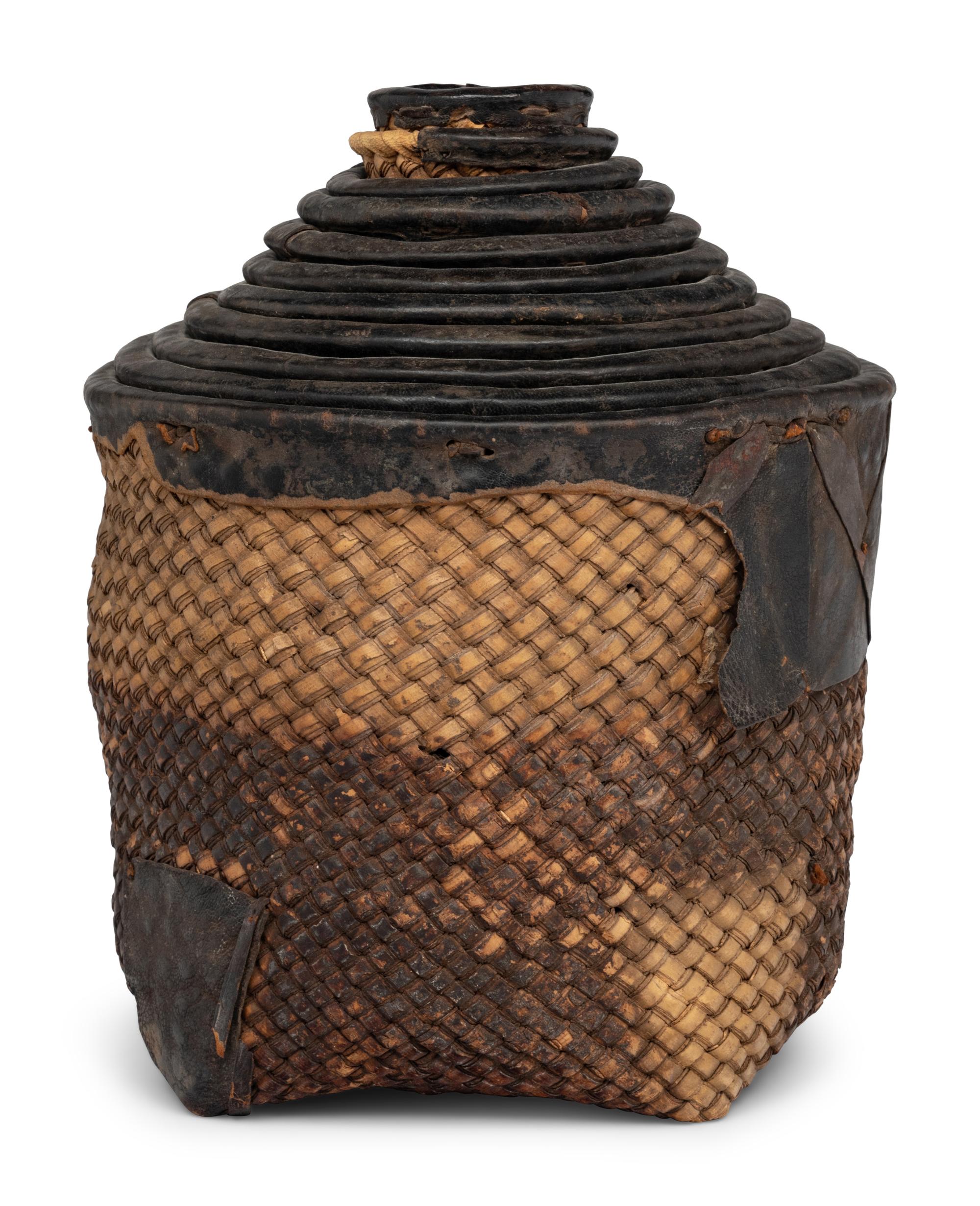 A Set of Eleven Woven and Leather Nesting Baskets