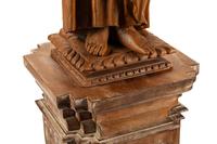 A Continental Carved Wood Figure of a Saint with an Associated Pedestal