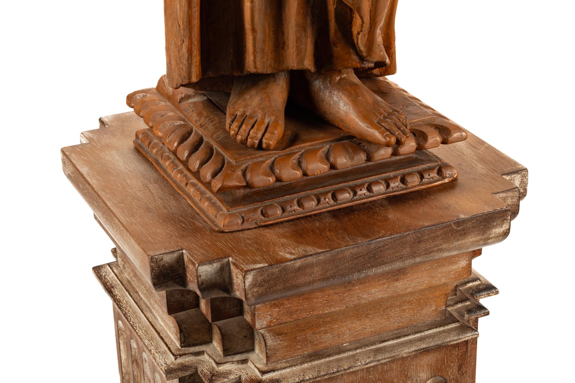 A Continental Carved Wood Figure of a Saint with an Associated Pedestal