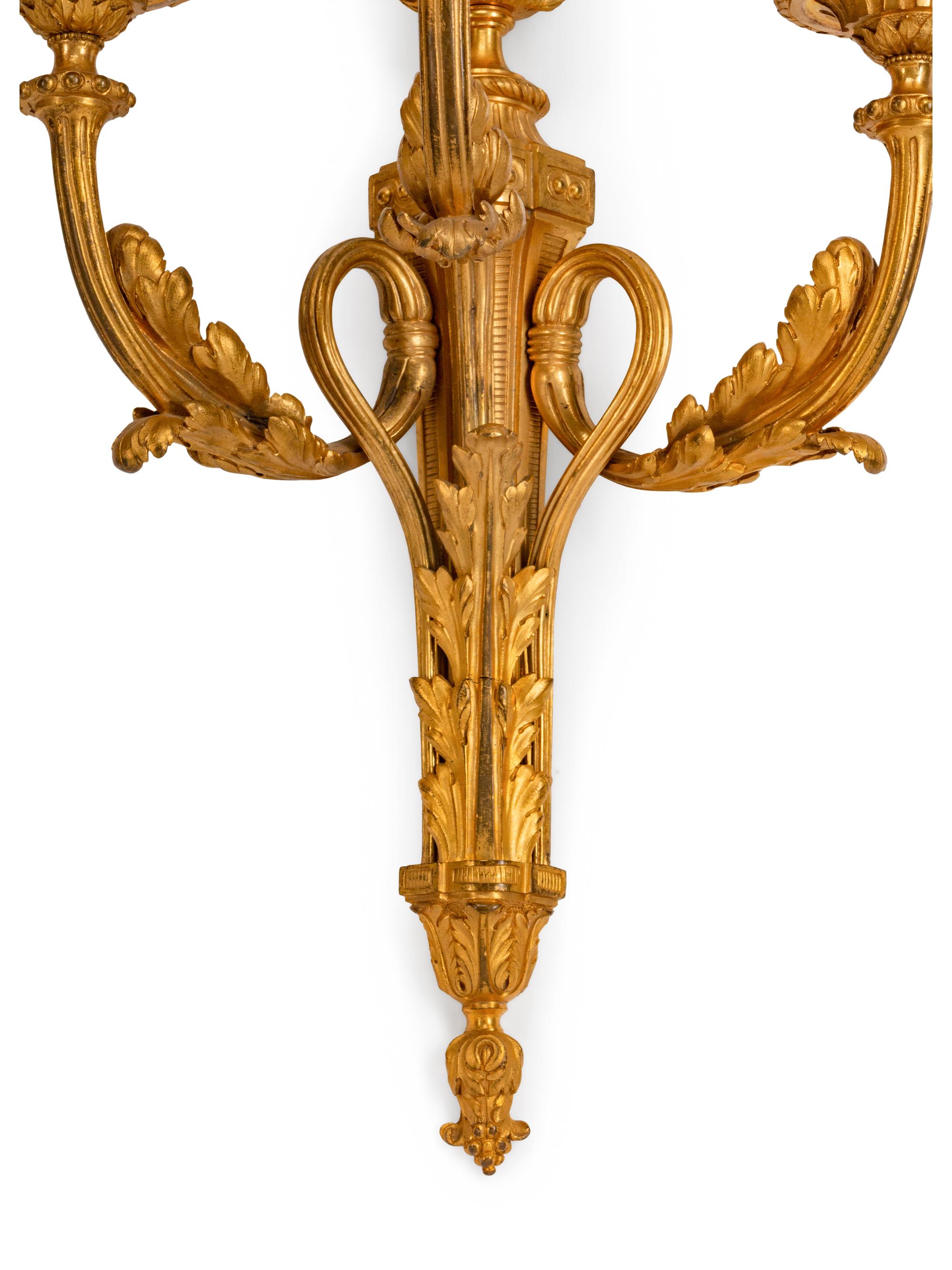 A Pair of Louis XVI Style Gilt-Bronze Three-Light Sconces