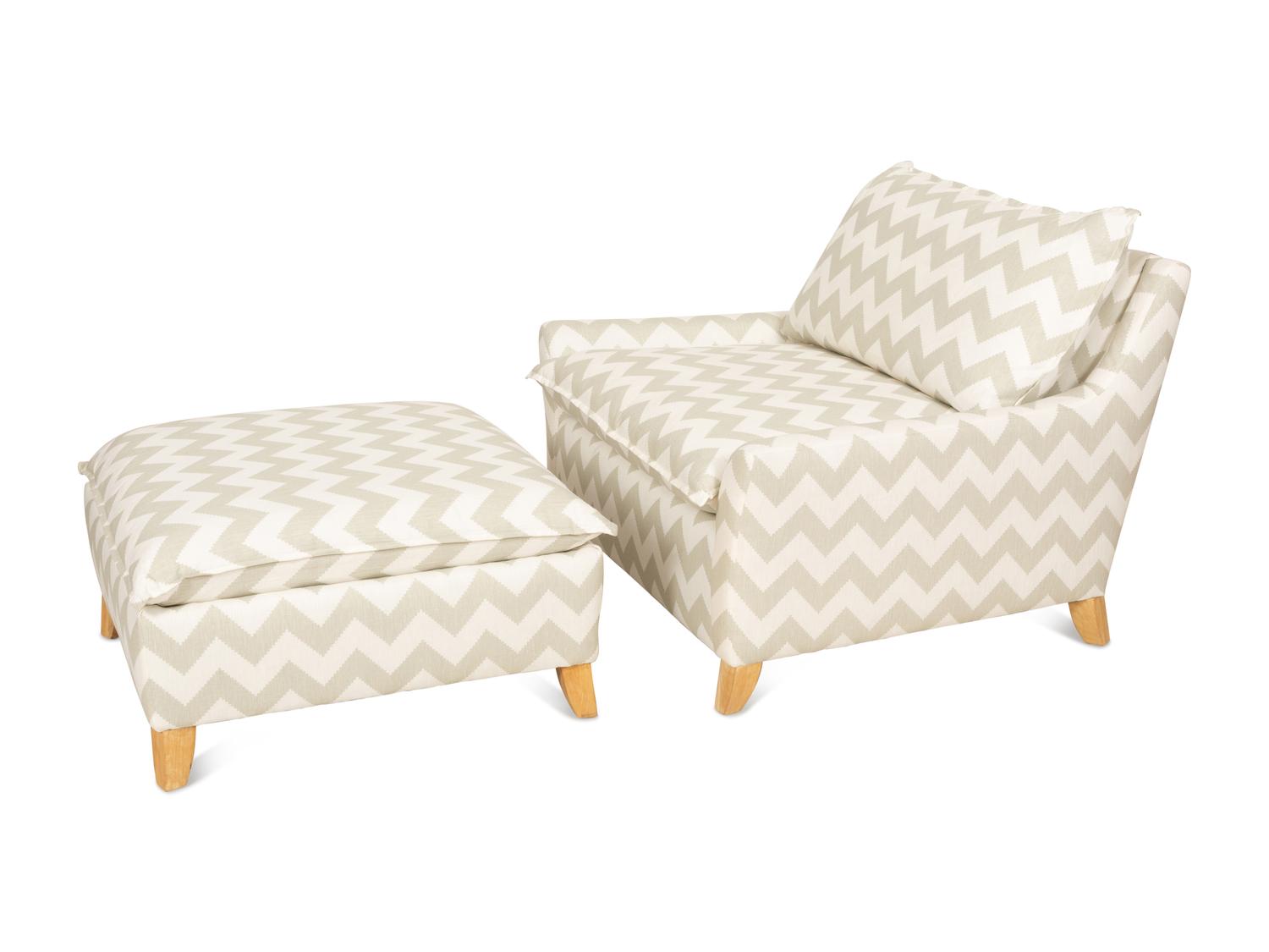 A Contemporary Upholstered Armchair and Ottoman