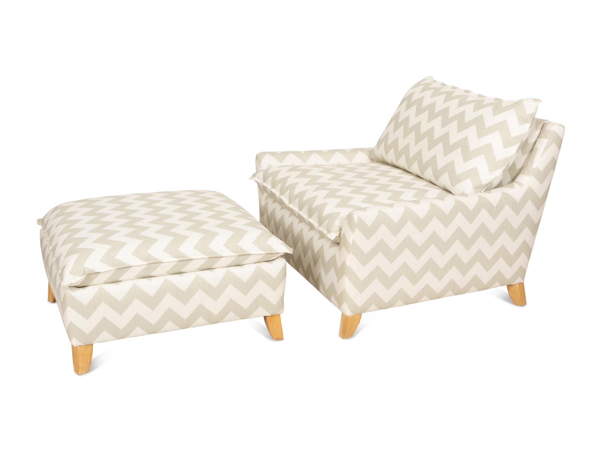 A Contemporary Upholstered Armchair and Ottoman