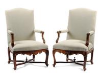 A Pair of Louis XV Style Carved Walnut Fauteuils