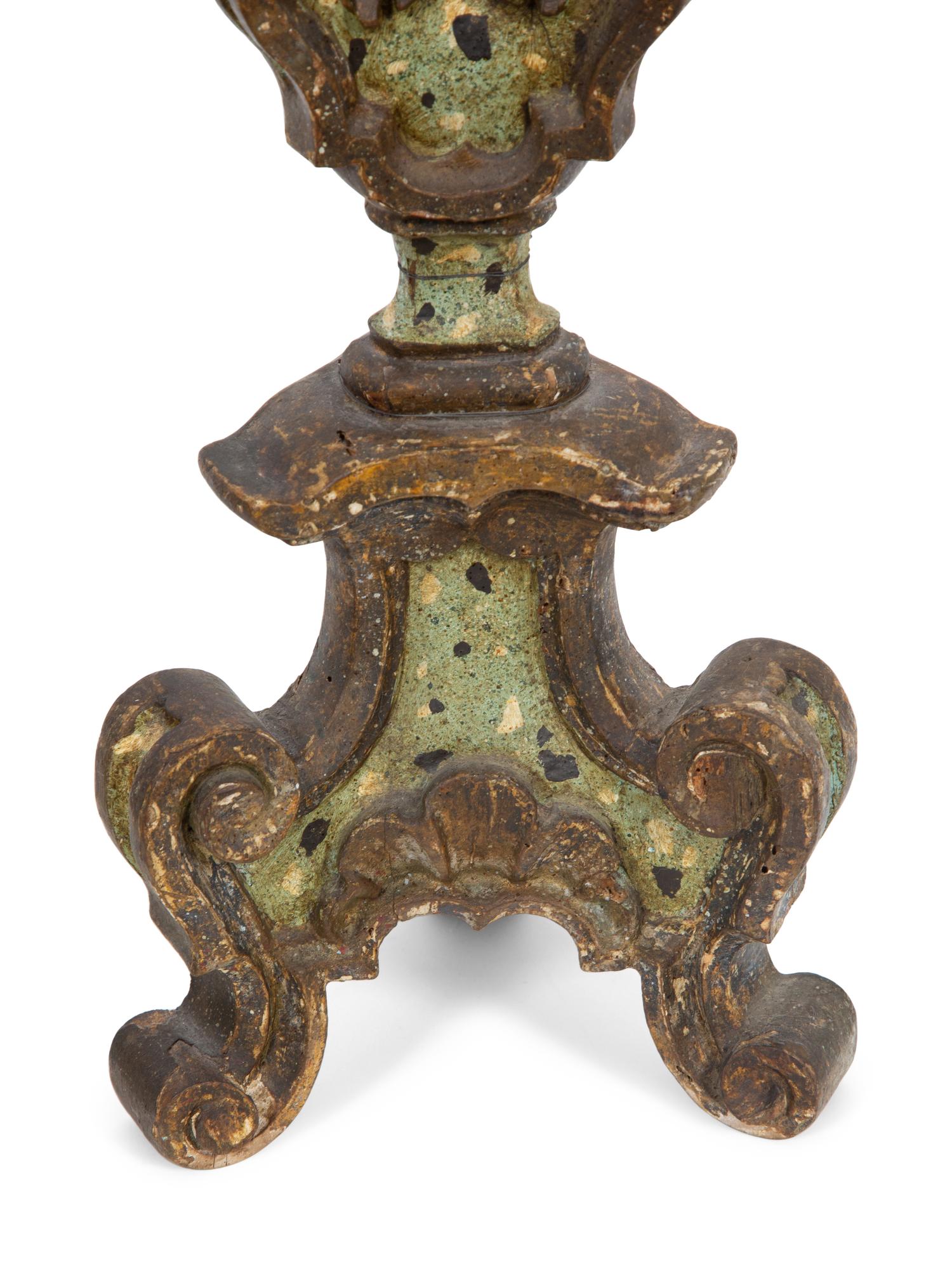 A Pair of Italian Painted and Parcel Gilt Pricket Candlesticks