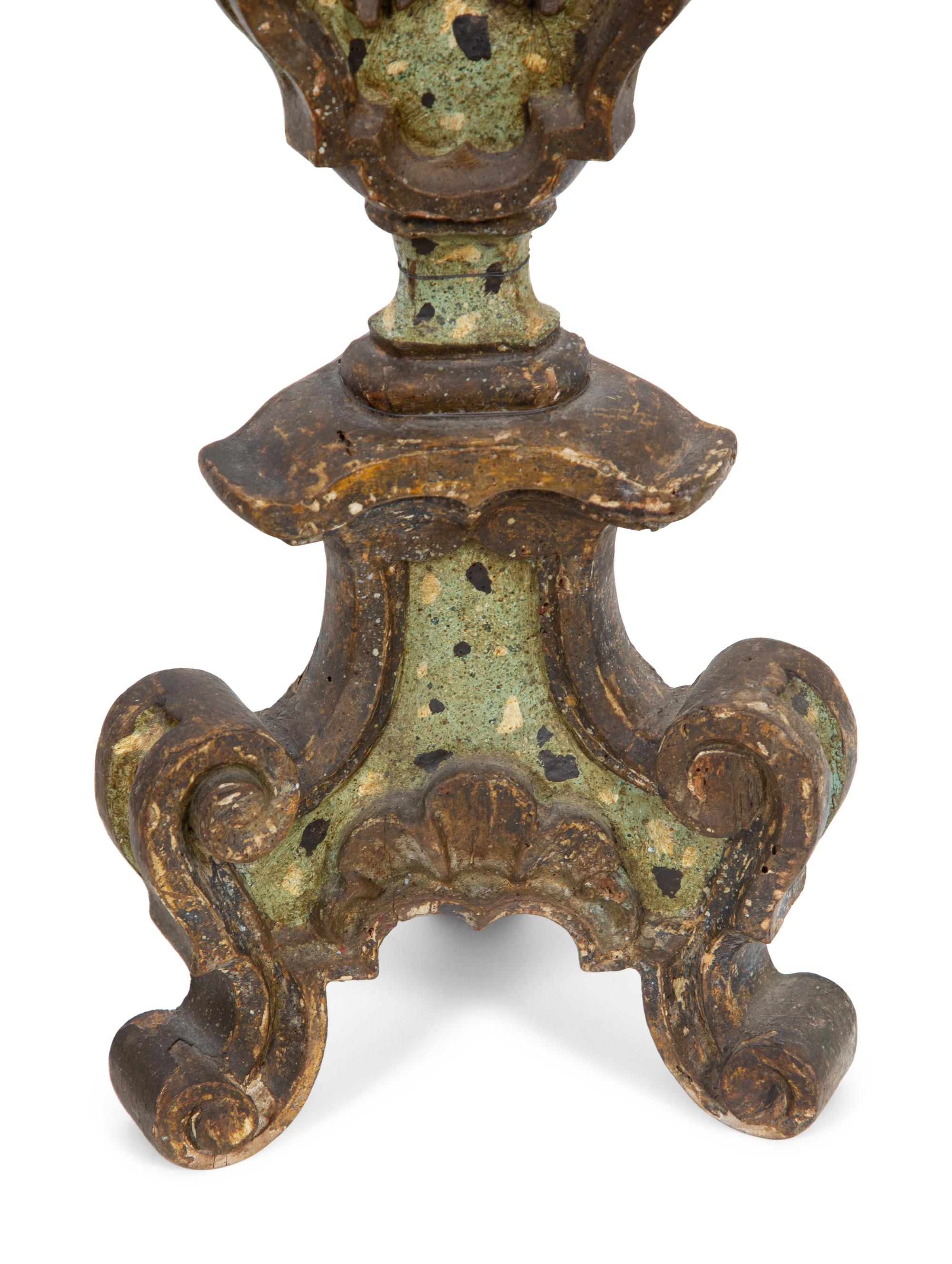 A Pair of Italian Painted and Parcel Gilt Pricket Candlesticks