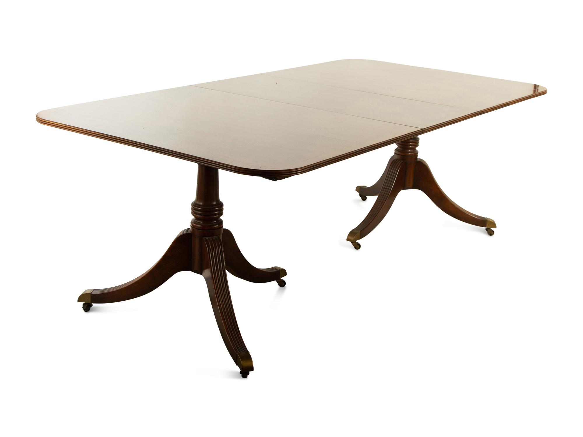 A Baker George III Style Mahogany Double-Pedestal Dining Table