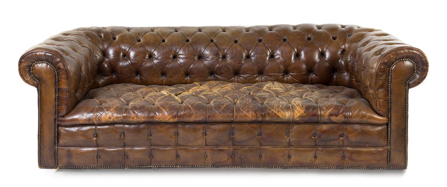 A Leather Upholstered Chesterfield Sofa Height 25 1/2 x width 81 1/2 x depth 36 1/2 inches.