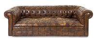 A Leather Upholstered Chesterfield Sofa Height 25 1/2 x width 81 1/2 x depth 36 1/2 inches.