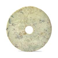 A Chinese Archaistic Mottled Pale Green Jade Bi Disc